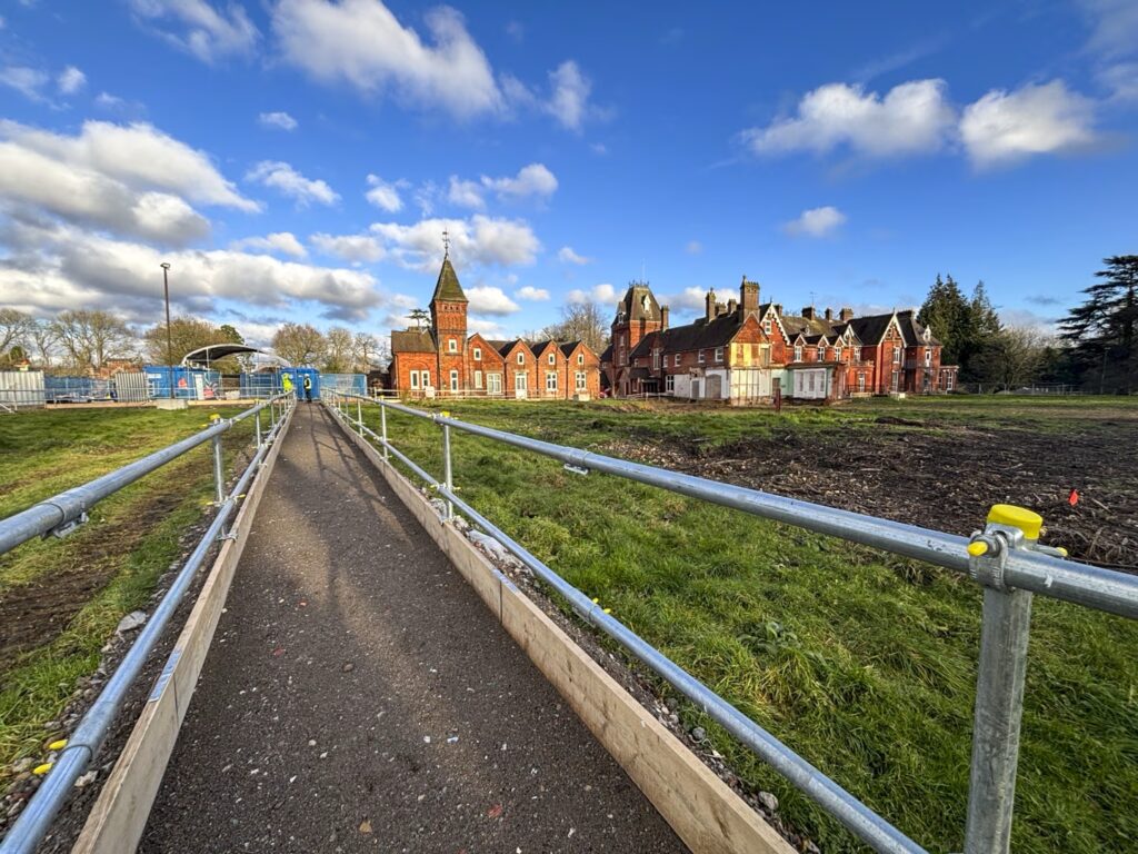 An image of the Rayners site from across a temporary bridge